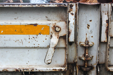 Rusty hinges on an old farm truck