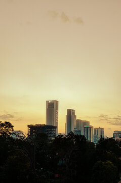 A section of the skyline of the city of Nairobi with tall buildings at sunset. 
