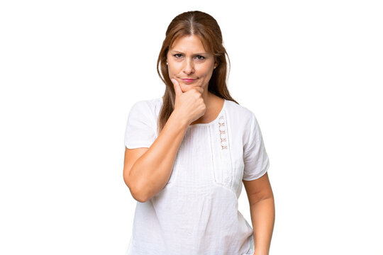 Middle-aged caucasian woman over isolated background thinking