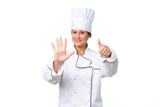 Middle-aged chef woman over isolated background counting six with fingers