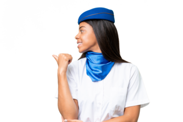 Airplane stewardess African american woman over isolated background pointing to the side to present a product