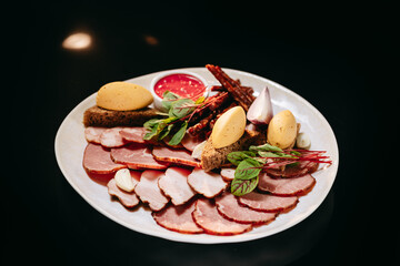 Meat cut with croutons and pate