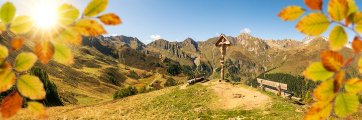 panoramic mountain range and leaves in autumn color