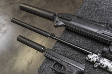 Firearms with a silencer, close-up photo.