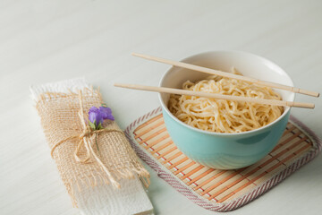 Ramen noodles in a bowl and chopsticks. Ramen concept. Noodle concept.