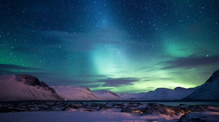 Northern lights in the night sky over snow-capped mountains.Travel and tourism concept.