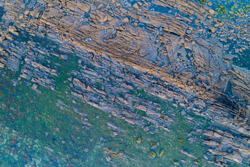 overhead aerial view of a rocky coast in the atlantic ocean