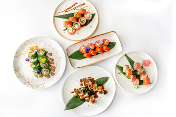 Top view of assorted sushi. Rainbow sushi roll, uramaki