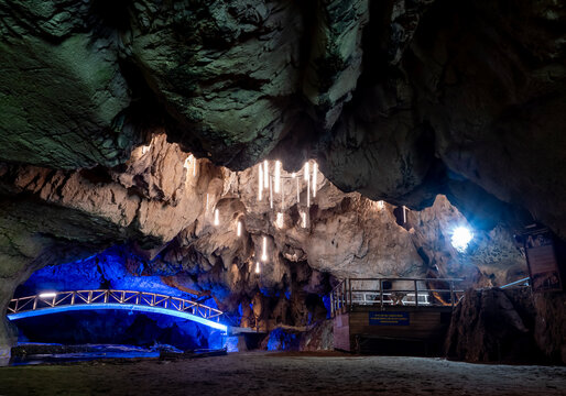 Bridge in Bolii cave ( Pestera Bolii ), near Petrosani city, Hunedoara county, Romania. The cave is artificially illuminated and is open to visitors.