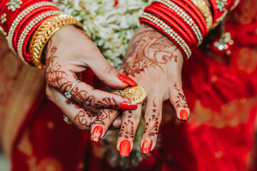 Bride Hands with mehendi and bangles