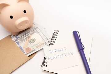 Money budget planning. Piggy bank with calculator and notebooks on white background, financial goal concept.