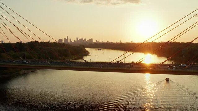 Aerial view of Siekierkowski bridge, Wisla Vistula river and center district of Warsaw at sunset.