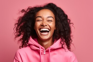 Headshot portrait photography of a joyful girl in her 30s wearing a comfortable tracksuit against a hot pink background. With generative AI technology