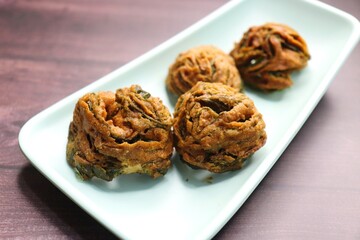 Dry Patra is an Indian dish made with colocasia leaves that are coated with a spicy gram flour...