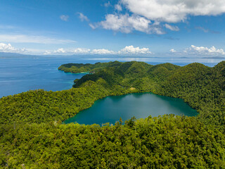 Fototapeta na wymiar Beautiful Lagoon in Bucas Grande. Blue sky and clouds. Turquoise water surface. Surigao del Norte. Mindanao, Philippines.