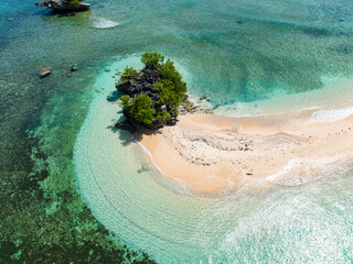 Air survey of beautiful sandbar with waves in tropical island and turquoise sea water. Millari Island. Mindanao, Philippines. Summer and travel concept.
