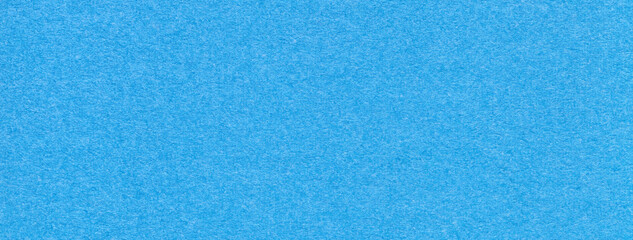 Texture of craft blue and turquoise paper background colors, macro. Structure of vintage dense kraft cerulean cardboard.