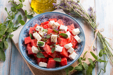 watermelon salad with feta cheese mint and lavender flowers