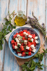 watermelon salad with feta cheese mint and lavender flowers