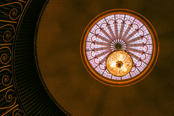 Abstract ornate light fitting in ceiling