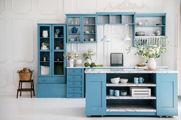 Fototapeta na wymiar Kitchen in scandinavian style with island table and blue furniture
