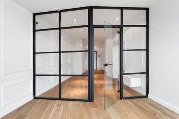room with glass divider in house with light design
