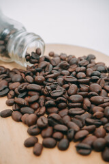 BACKGROUND OF SELECTED COFFEE BEANS ON CUTTING BOARD