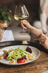 Delicious fresh salad with herbs, cheese and seafood. Proper nutrition, healthy lifestyle.