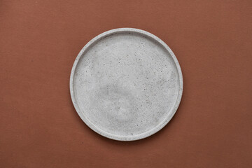 Gray ceramic plate isolated on white background.