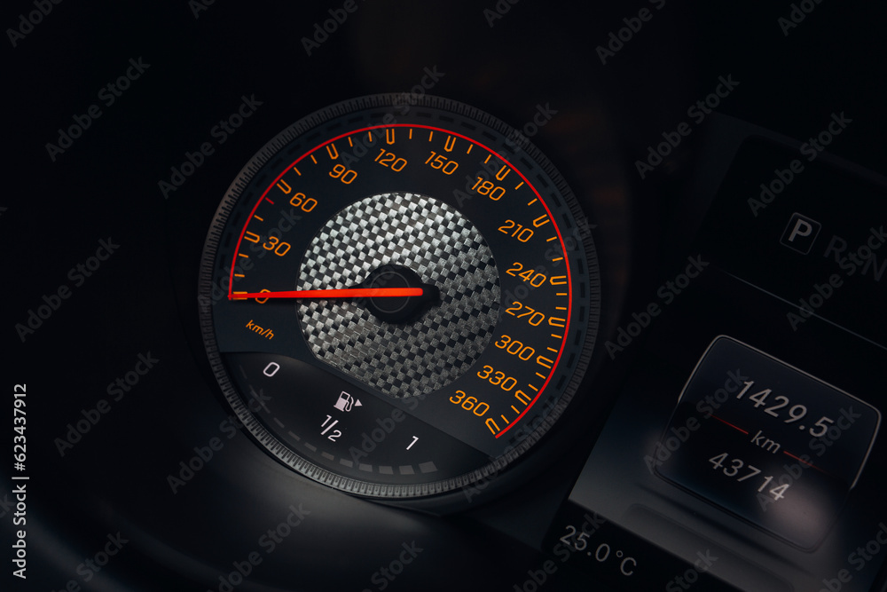 Wall mural Modern car close up view of tachometer and speedometer carbon dashboard with backlight