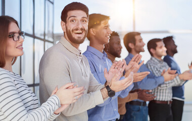 young aspiring young people clapping their hands at the seminar