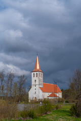 The Pühalepa Church in Hiiamma, Estonia on a cloudy spring day. Hiiumaa’s oldest stone church. 