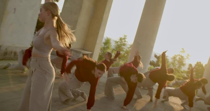 Dancing group is performing an interpretive dance in a temple, modern, 4k