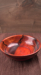 Empty wooden bowl and wooden spoon isolated with copy space.