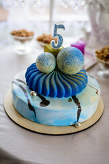 Obraz na płótnie Canvas Delicious blue two-tiered birthday cake in the form of spheres .