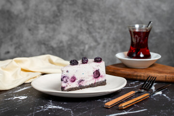 Blueberry cake. Blueberry fruit slice cake on dark background