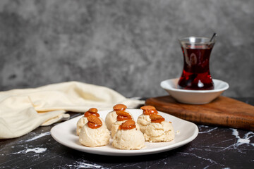 Almond and caramel cookies. Almond cookies on dark background