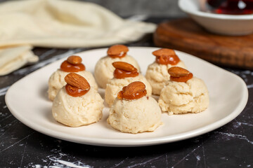 Almond and caramel cookies. Almond cookies on dark background. Close up