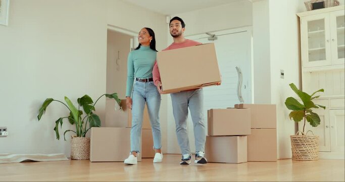 Cardboard, moving and young couple with a boxes for their new house, apartment or real estate. Happy, walking and excited people in the living room with packages or parcels in their modern home.