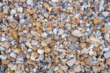 River gravels background. Mixed sea gravels.