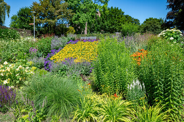 various colors of flowers and plants in a large park in germany in wassenberg