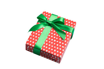 Wrapped christmas or other holiday handmade present in paper with colored ribbon. Present box,...