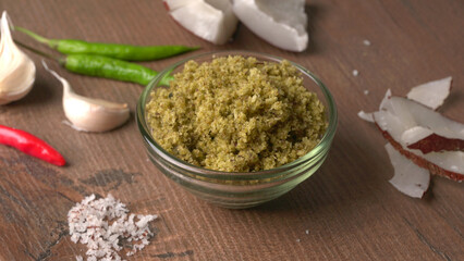 Coconut chutney in a bowl with raw coconut and green chilli ,Served with dosa, idli, vada