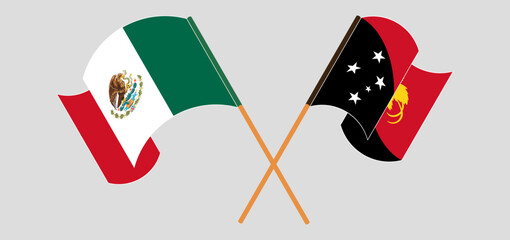 Crossed and waving flags of Mexico and Papua New Guinea
