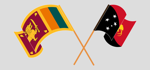 Crossed and waving flags of Sri Lanka and Papua New Guinea