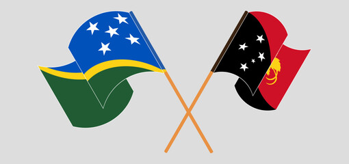 Crossed and waving flags of Solomon Islands and Papua New Guinea