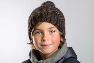 Headshot portrait photography of a tender boy in his 30s wearing a warm beanie or knit hat against a white background. With generative AI technology