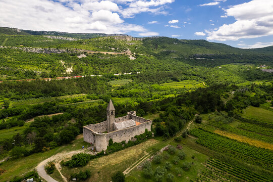 Holy Trinity Church in Hrastovlje, Slovenia. Frescoes of famous Dance of Death ( Danse Macabre ). Drone view.