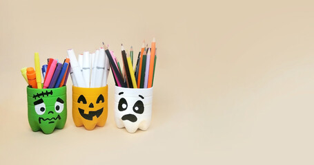 The art of handmade recycling from plastic bottle. Halloween craft ideas of container for pencils....