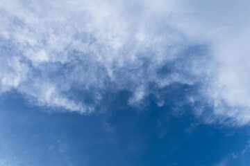 Beautiful blue sky background, white clouds covering thinly spread the sky